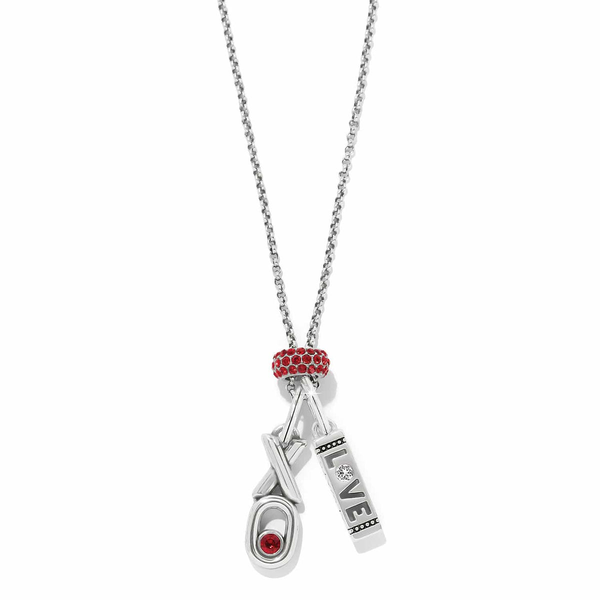 Brighton silver-plated charm necklace with red crystal bead, love bar charm, and XO charm on a white background