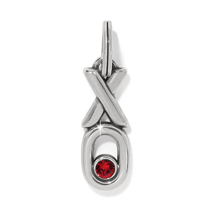 Brighton silver-plated charm with XO design and red crystal accent in the O on a white background