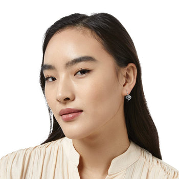 Side view of model wearing Alcazar Heart Leverback Earrings