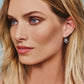 Close up of model wearing Alcazar Heart Leverback Earrings
