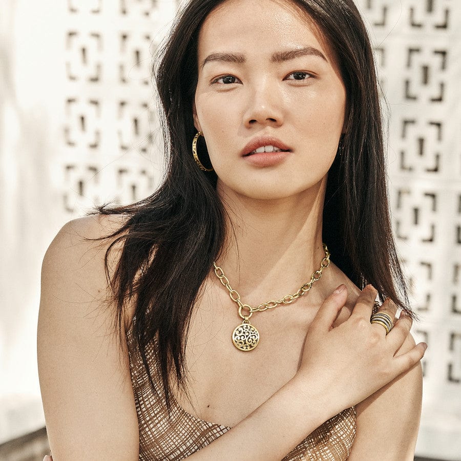Model wearing Gold Contempo Large Hoop Earrings