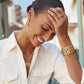 Modeling wearing Gold Contempo Medium Hoop Earrings looking down