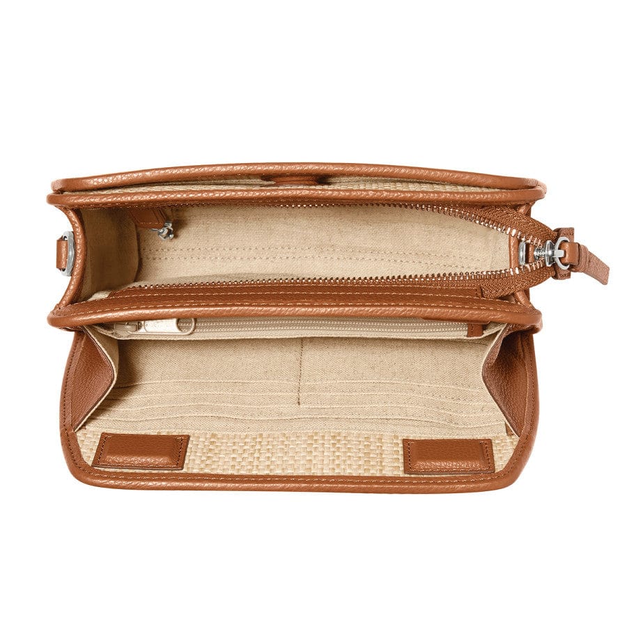 Dani Straw Organizer a faux straw fabric bag opened to show its empty inner compartments with linen lining