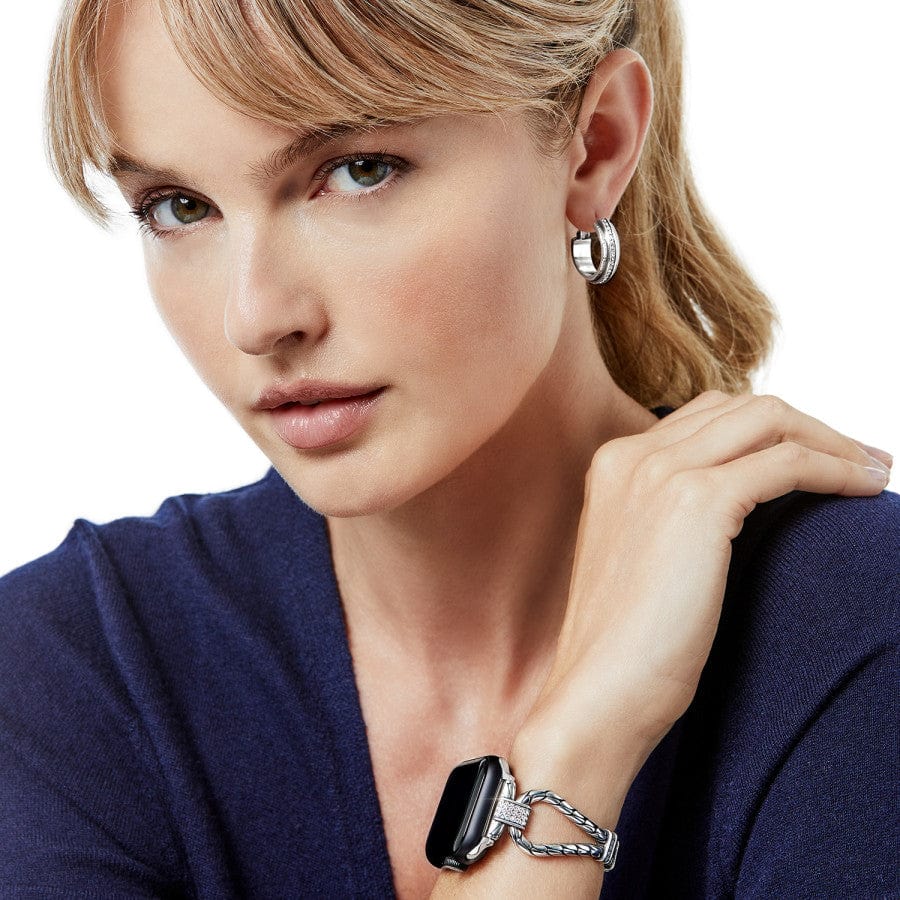Woman wearing Meridian Tempo Apple Watch Band with matching earrings looking at you