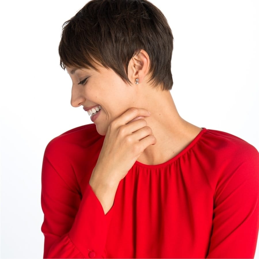 Model wearing Snowman Mini Post Earrings looking to the left		