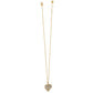 A gold heart-shaped pendant encrusted with small crystals, hanging from a delicate gold chain, the Trust Your Journey Golden Heart Necklace is isolated against a white background.